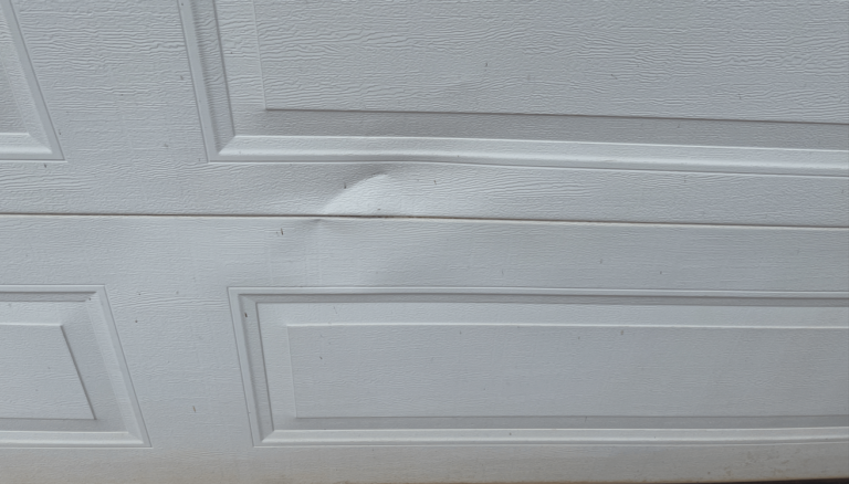 How to Repair a Dented Garage Door